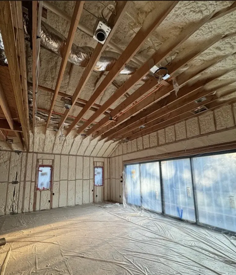 Interior walls and ceiling insulated with spray foam during new construction in Carterville